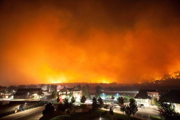 Colorado home fully engulfed in wildfire flames at night